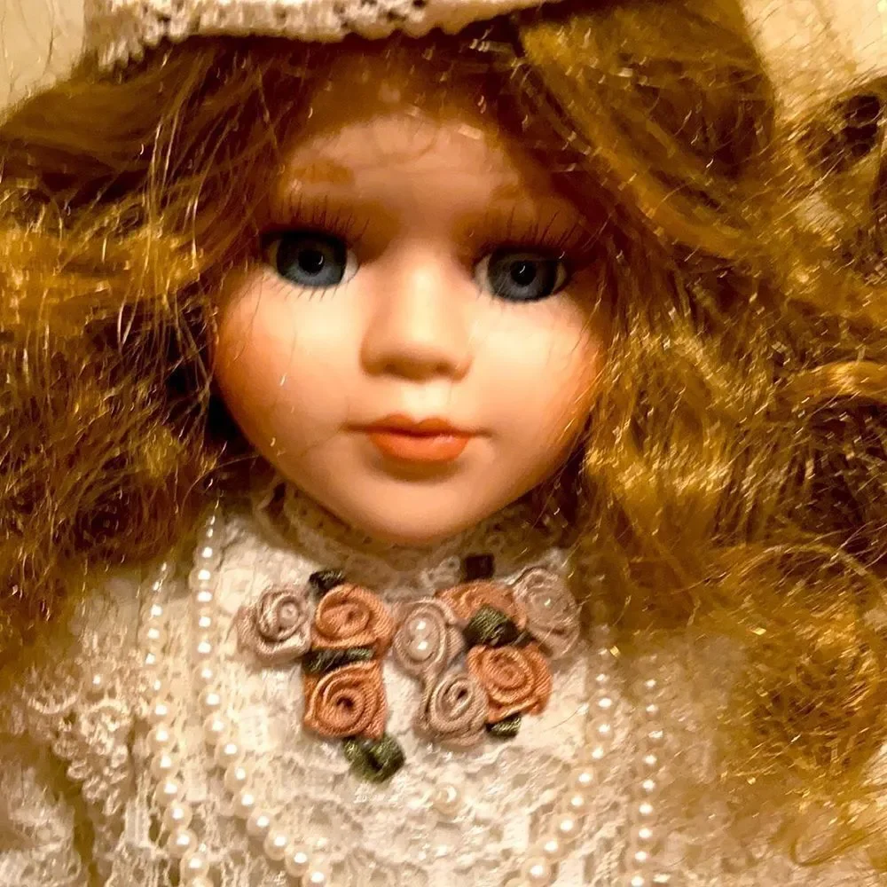 Porcelain doll with satan and lace trim dress with umbrella 15 inches